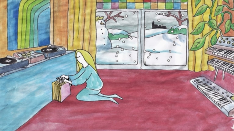A still from Ambient Trip Commander showing a person inside a colourful cabin amid a snowy landscape, browsing through vinyl records